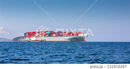 Cargo Container Ship with Tug boat in sea. Cargo marine vessel. Cargo Container Ship with Tug boat in sea. Cargo marine vessel. 132810267