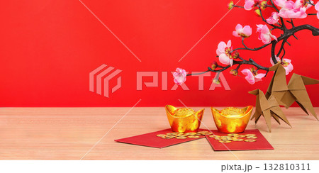 Chinese New Year gold ingots and red envelopes 132810311