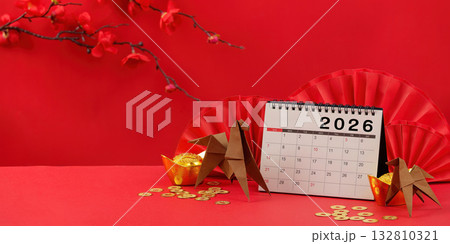 Chinese New Year 2026. Calendar with origami and gold decorations on red background. Chinese New Year 2026. Calendar with origami and gold decorations on red background. 132810321
