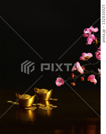 Golden ingots and cherry blossoms for Chinese New Year Golden ingots and cherry blossoms for Chinese New Year 132810325