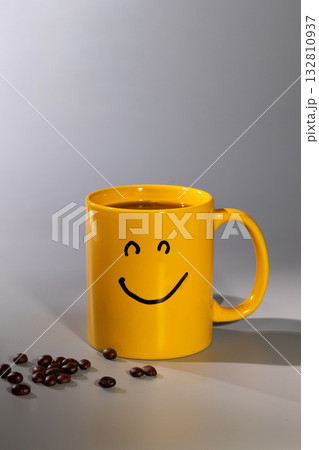Bright Yellow Mug With a Smiley Face Brings Joy to Your Morning Coffee Routine 132810937