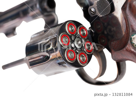 Closeup of revolver with open fully loaded cylinder Closeup of revolver with open fully loaded cylinder 132811084