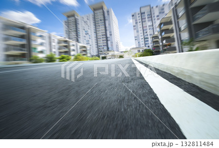 Urban road speeding through modern city buildings 132811484