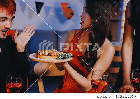 Joyful office Halloween party with coworkers in costumes, celebrating with drinks and laughter, fostering teamwork and festive spirit Joyful office Halloween party with coworkers in costumes, celebrating with drinks and laughter, fostering teamwork and festive spirit 132811657