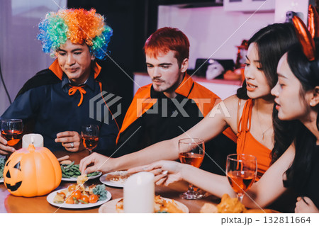 Joyful office Halloween party with coworkers in costumes, celebrating with drinks and laughter, fostering teamwork and festive spirit Joyful office Halloween party with coworkers in costumes, celebrating with drinks and laughter, fostering teamwork and festive spirit 132811664