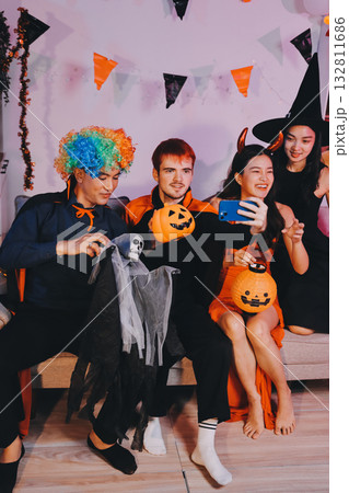 Joyful office Halloween party with coworkers in costumes, celebrating with drinks and laughter, fostering teamwork and festive spirit Joyful office Halloween party with coworkers in costumes, celebrating with drinks and laughter, fostering teamwork and festive spirit 132811686