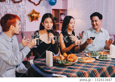 Diversity, dinner and group of people toast celebration together at party. Friends, happy and celebrate with food, wine and friendship for love, support and cheers champagne at business function 132811687