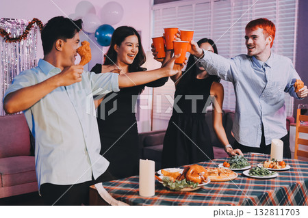 Diversity, dinner and group of people toast celebration together at party. Friends, happy and celebrate with food, wine and friendship for love, support and cheers champagne at business function 132811703