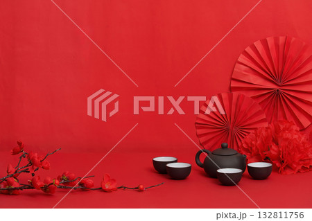 Minimalist Background with Teapot and Red Decorations for Lunar New Year 132811756