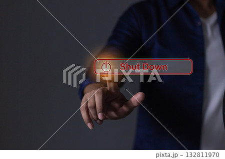 Young man hand touching Shut Down button press power OFF Young man hand touching Shut Down button press power OFF 132811970