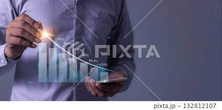 Young man with smartphone hand touching to visualize money growth The phone screen displays graphs  132812107