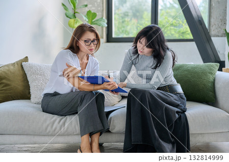 Young woman patient talking with female psychologist, mental counselor 132814999