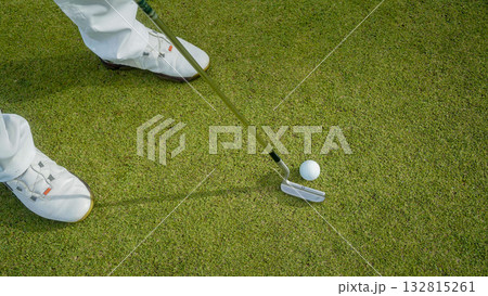Golfers are putting golf in the evening golf course golf backglound. 132815261