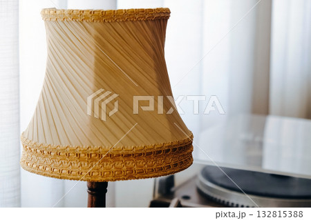 Detail image of Vintage lamp on table in living room interior Detail image of Vintage lamp on table in living room interior 132815388
