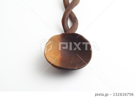 Empty spoon made of wood on white background. Top view. 132816756