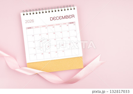 December 2026 desk calendar with pink pastel ribbon. 132817033