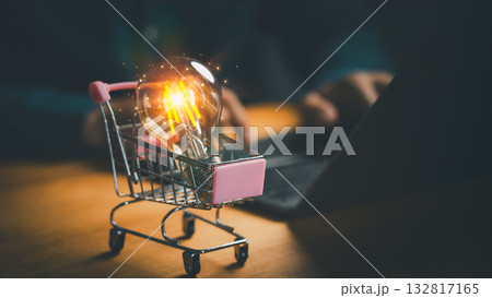 Creative idea shopping concept with glowing light bulb inside shopping cart, symbolizing innovation, online business, digital marketing, e-commerce creativity, smart solutions and consumer technology. Creative idea shopping concept with glowing light bulb inside shopping cart, symbolizing innovation, online business, digital marketing, e-commerce creativity, smart solutions and consumer technology. 132817165