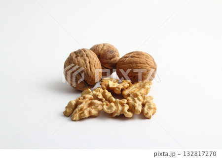 Peeled walnut closeup. Golden walnut kernel on a white background. Healthy foods. Selective Focus. 132817270