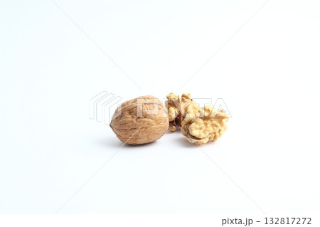 Walnut on the white background. Close up shot of whole walnut isolated on white background. Walnut on the white background. Close up shot of whole walnut isolated on white background. 132817272
