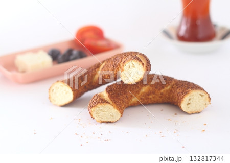 Turkish bagel, simit, tomatoes & Turkish tea on white background. 132817344