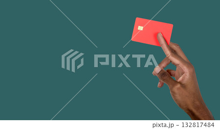 Hand holding bank card mockup close up. African American male showing plastic credit card for secure 132817484