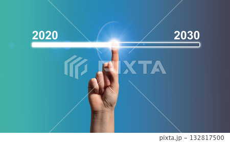 Hand pointing to glowing digital timeline from 2020 to 2030 symbolizing innovation and progress. Hand pointing to glowing digital timeline from 2020 to 2030 symbolizing innovation and progress. 132817500