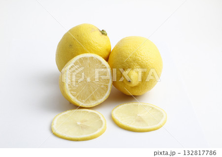 Ripe whole yellow lemon citrus fruit with lemon slice isolated on white background with clipping path. 132817786