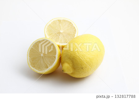 Ripe whole yellow lemon citrus fruit with lemon slice isolated on white background with clipping path. 132817788