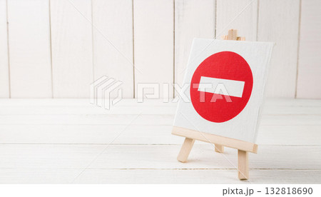 Red No Entry Symbol on White Canvas Displayed on Small Wooden Easel Red No Entry Symbol on White Canvas Displayed on Small Wooden Easel 132818690