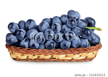 dark blue grape berry bunch in a wicker basket isolated on white background 132819123