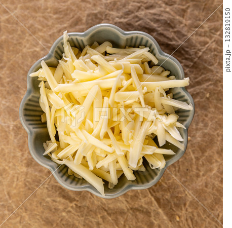 Shredded cheese waiting in a bowl Shredded cheese waiting in a bowl 132819150