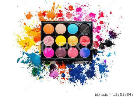 A vibrant palette of twelve colorful eyeshadows arranged neatly on a base with splashes of paint in various hues surrounding it. 132819848