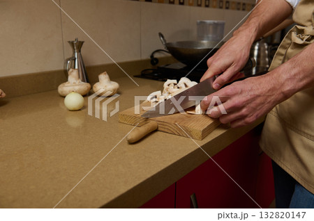 Father Cooking In Kitchen, Slicing Mushrooms On Wooden Board For Dinner For Kids 132820147
