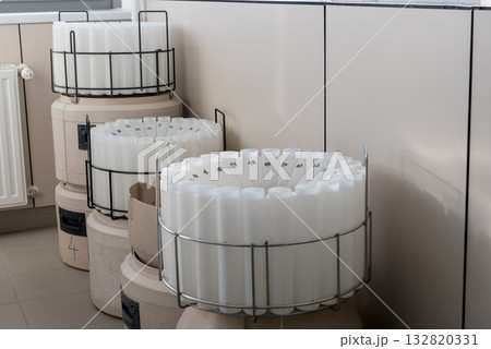 Blue plastic storage boxes on a laboratory counter.Automatic wastewater sampler equipment in laboratory setting. 132820331