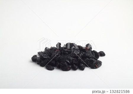 black raisins isolated on a white background 132821586