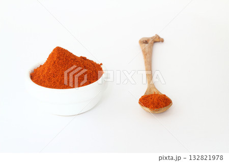 red dried crushed hot chili peppers and chili flakes or powder isolated on white background 132821978
