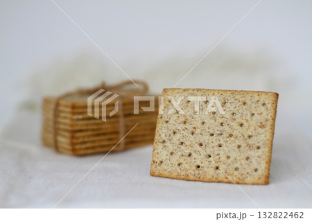 Pile of crackers with different seeds isolated on white background. Pile of crackers with different seeds isolated on white background. 132822462