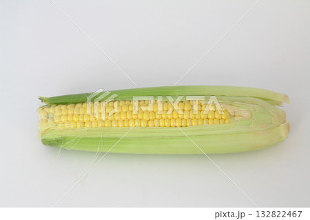 Raw corn on a white the background 132822467