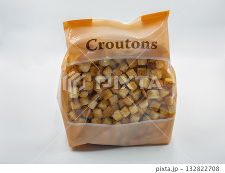 Bag of crunchy croutons closeup on white background. Bag of crunchy croutons closeup on white background. 132822708