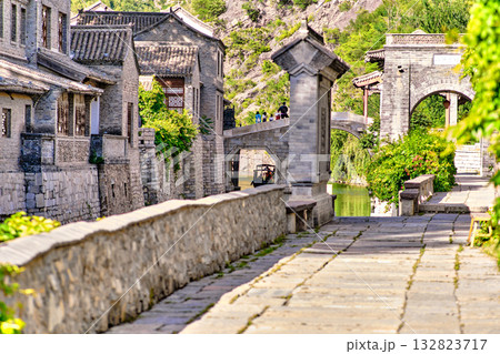 The ancient water town of Gubei near the site of the Great Wall of Simatai on a clear summer day. 132823717