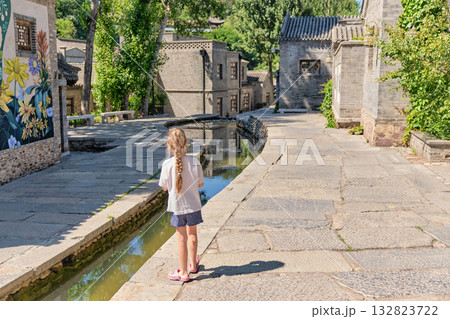 The ancient water town of Gubei near the site of the Great Wall of Simatai on a clear summer day. 132823722