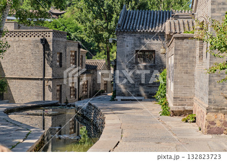 The ancient water town of Gubei near the site of the Great Wall of Simatai on a clear summer day. The ancient water town of Gubei near the site of the Great Wall of Simatai on a clear summer day. 132823723