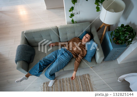 Drained mature woman lies motionless on sofa overwhelmed by mental exhaustion and sorrow at home Drained mature woman lies motionless on sofa overwhelmed by mental exhaustion and sorrow at home 132825144