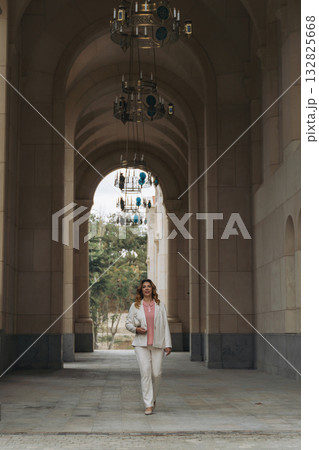 Woman Walking Archway Building Entrance 132825668