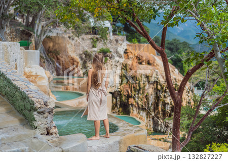 Female tourist exploring Grutas Tolantongo in Mexico, enjoying natural hot springs, scenic caves, and outdoor adventure. Travel, wellness, and sightseeing concept Female tourist exploring Grutas Tolantongo in Mexico, enjoying natural hot springs, scenic caves, and outdoor adventure. Travel, wellness, and sightseeing concept 132827227