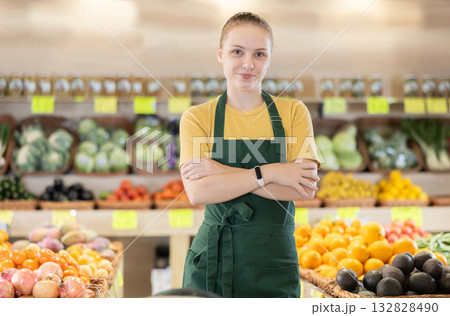 Teenage girl seller in vegetable shop Teenage girl seller in vegetable shop 132828490