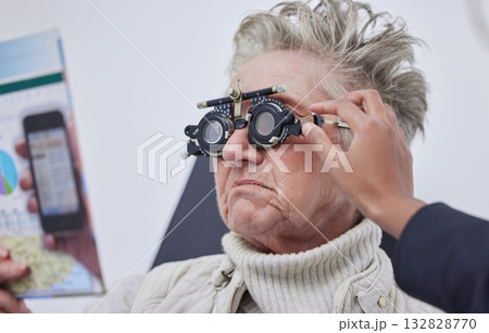 Vision, trial frame and woman for eye exam in optometry clinic for test, eyesight and optical assessment. Ophthalmology, health and elderly patient reading with optician, optometrist and glasses 132828770