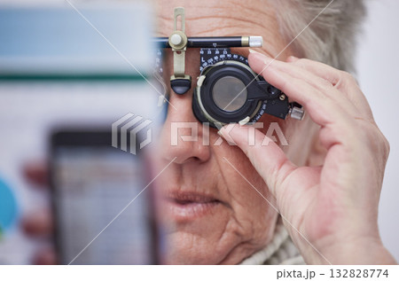 Eye exam, vision and senior woman with lens in clinic for testing eyes, eyesight and optical assessment. Optometry, healthcare and elderly patient reading for optician, medical care and trial glasses Eye exam, vision and senior woman with lens in clinic for testing eyes, eyesight and optical assessment. Optometry, healthcare and elderly patient reading for optician, medical care and trial glasses 132828774
