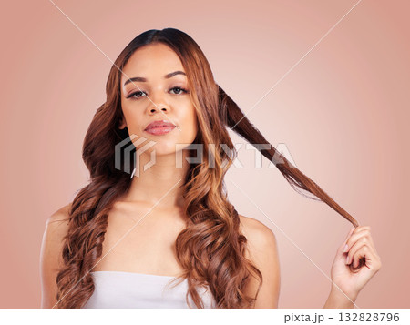 Face portrait, hair care and beauty of woman in studio isolated on a pink background. Aesthetics, cosmetics and female model with salon treatment for balayage, growth and texture for curly hairstyle. Face portrait, hair care and beauty of woman in studio isolated on a pink background. Aesthetics, cosmetics and female model with salon treatment for balayage, growth and texture for curly hairstyle. 132828796