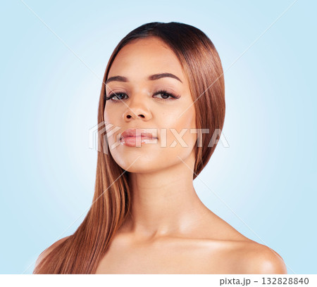 Makeup, beauty and portrait of black woman in studio for skincare, grooming and glamour on blue background. Face, cosmetic and girl model relax with luxury, wellness and natural glowing skin isolated 132828840